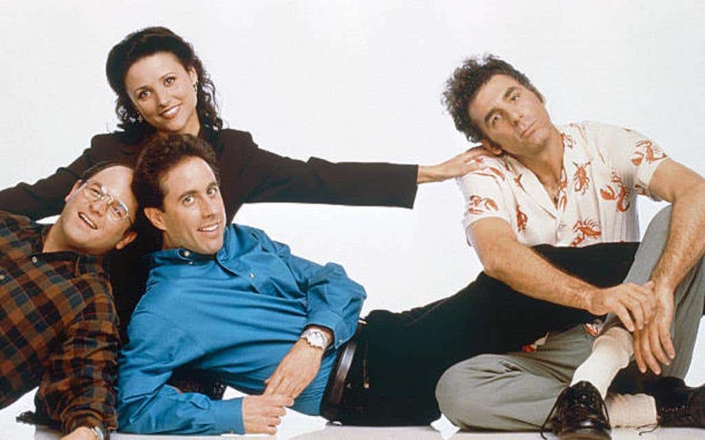 The cast of the often re-watched Seinfeld tv show pose on a white background. Jason Alexander as George Costanza, Jerry Seinfeld as Jerry Seinfeld, (back, l-r) Julia Louis-Dreyfus as Elaine Benes, Michael Richards as Cosmo Kramer