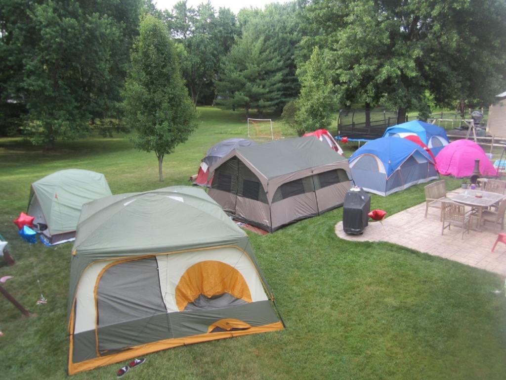 July th barbeque tent event with a yard full of tents