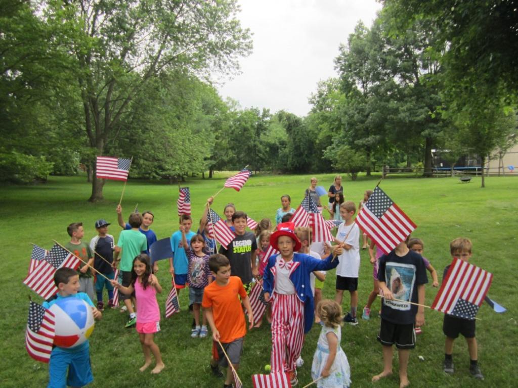 Barbeque on July 4th with kids and flags celebrating