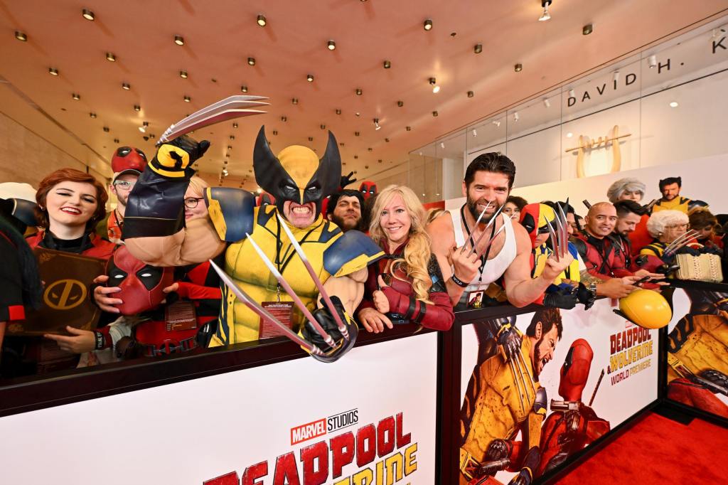 A group of Wolverine and Deadpool fans dressed as the characters at the premiere of Deadpool and Wolverine